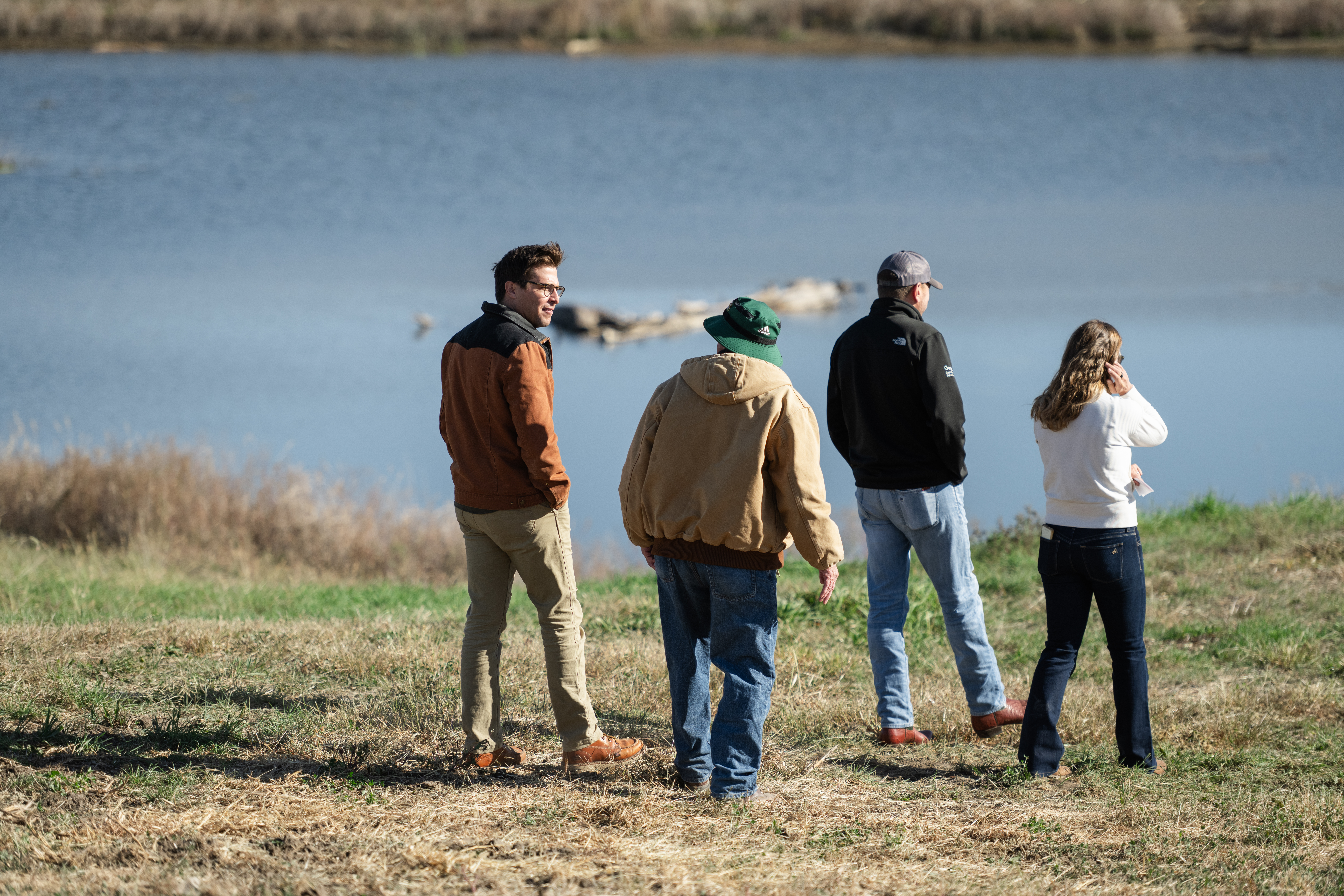 Group of people walking near wetland